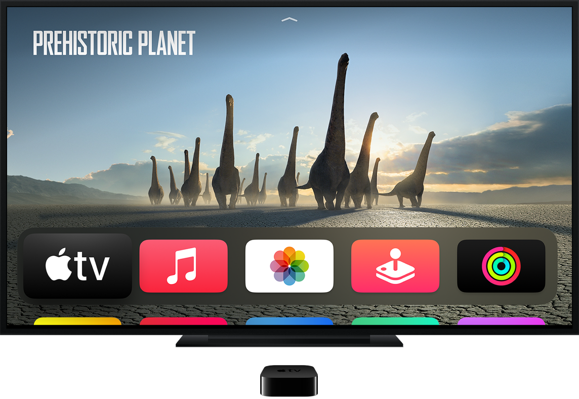 Apple TV podłączony do telewizora. Na telewizorze wyświetlany jest ekran początkowy
