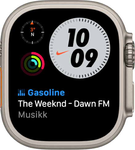 Urskiven Kompakt Nike som viser en Kompass-komplikasjon øverst til venstre, klokkeslettet øverst til høyre, Aktivitet-komplikasjonen i midten til venstre og Musikk-komplikasjonen nederst.