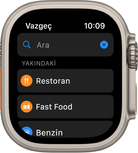 Harita uygulamasının arama ekranı üst tarafta arama alanını gösteriyor. Yakındaki başlığı altında restoran, benzin istasyonu ve fast food düğmeleri bulunuyor.