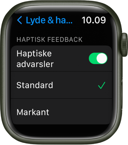 Indstillinger for Lyde & haptisk feedback på Apple Watch, med kontakten Haptiske advarsler og mulighederne Standard og Markant nedenunder.