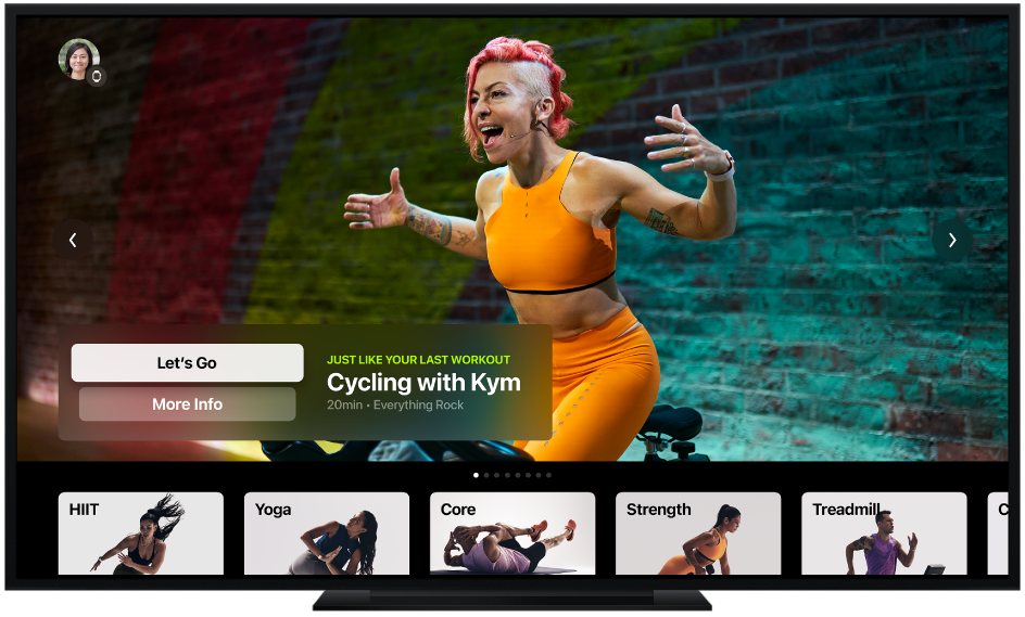 A TV showing the Apple Fitness+ screen, including workout types and a recommended cycling workout.