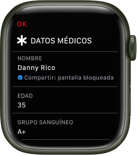 La pantalla de datos médicos en el Apple Watch, con el nombre del usuario, la edad y el grupo sanguíneo. Debajo del nombre hay una marca de verificación que indica que los datos médicos se comparten en la pantalla de bloqueo. El botón OK se encuentra en la parte superior izquierda.