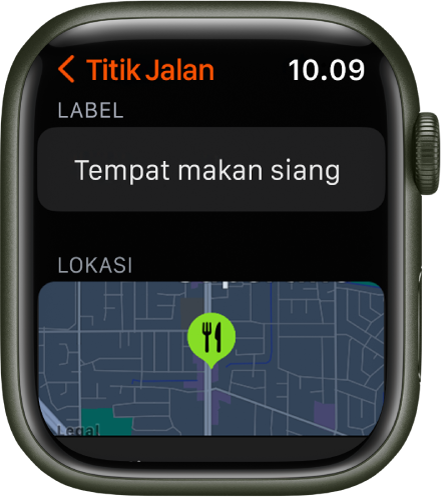 App Kompas menampilkan layar pengeditan titik jalan. Bidang Label berada di bagian atas. Di bawahnya terdapat area Lokasi yang menampilkan lokasi titik jalan di peta. Simbol makan malam telah diterapkan ke titik jalan.