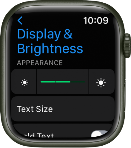 Ekrāna & spilgtuma iestatījumi Apple Watch pulkstenī ar slīdni Brightness augšā un pogu Text Side apakšā.