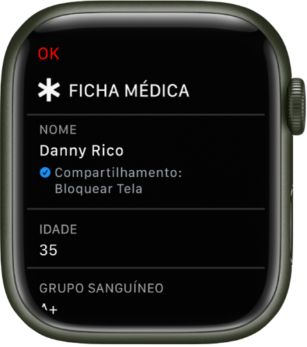 Tela Ficha Médica no Apple Watch mostrando nome, idade e tipo de sangue do usuário. Há uma marca de verificação abaixo do nome, indicando que a Ficha Médica está sendo compartilhada na tela bloqueada. O botão OK encontra-se na parte superior esquerda.