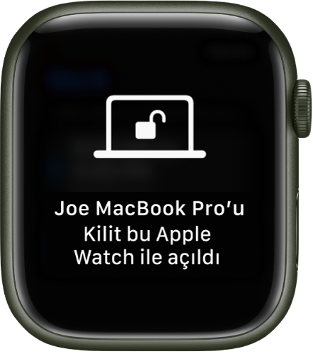 “Ali’nin MacBook Pro’sunun kilidi bu Apple Watch tarafından açıldı” iletisini gösteren Apple Watch ekranı.