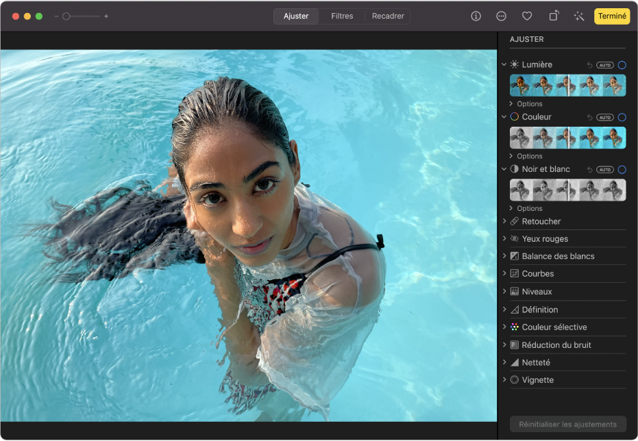 Une photo en mode édition, avec l’option Ajuster sélectionnée dans la barre d’outils et les outils d’ajustement sur la droite.