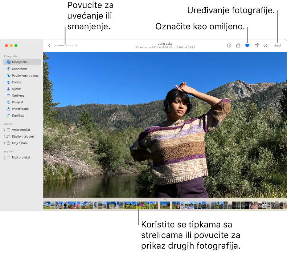 Prozor aplikacije Foto s prikazom uvećane fotografije na desnoj strani i redom minijatura ispod nje. Alatna traka na vrhu uključuje kliznik za zumiranje, tipku Omiljeno i tipku Uredi.