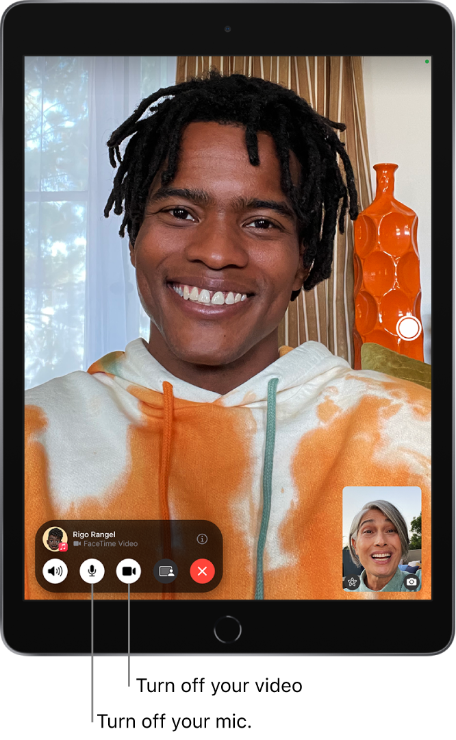 A FaceTime call in progress. Your image appears in a small tile near the bottom right, and the image of the other person fills the rest of the screen. The small tile includes the Effects and Flip to Back Camera buttons. The Live Photo button is on the right side of the screen. The FaceTime controls are at the bottom of the screen, including the Audio, Mic, Camera, Share Content, and End buttons. At the top of the controls are the name or Apple ID of the person you’re talking to and the Info button.