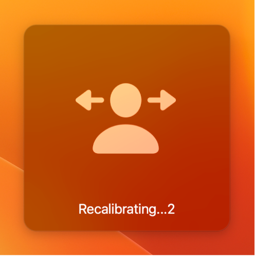 The onscreen countdown for head pointer recalibration, showing “Recalibrating…2”.