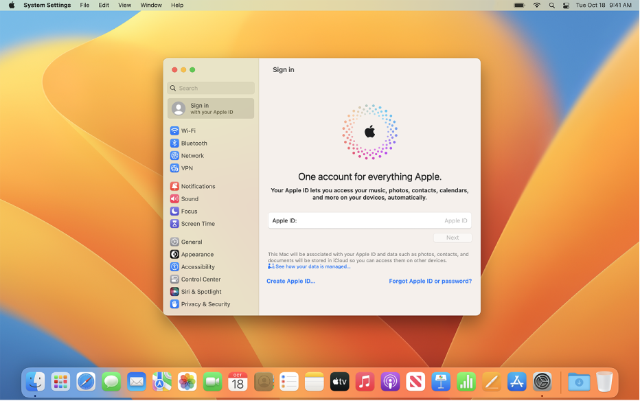 खुली हुई सिस्टम सेटिंग्ज़ के साथ Mac डेस्कटॉप जो Apple ID साइन-इन विंडो दिखा रहा है।