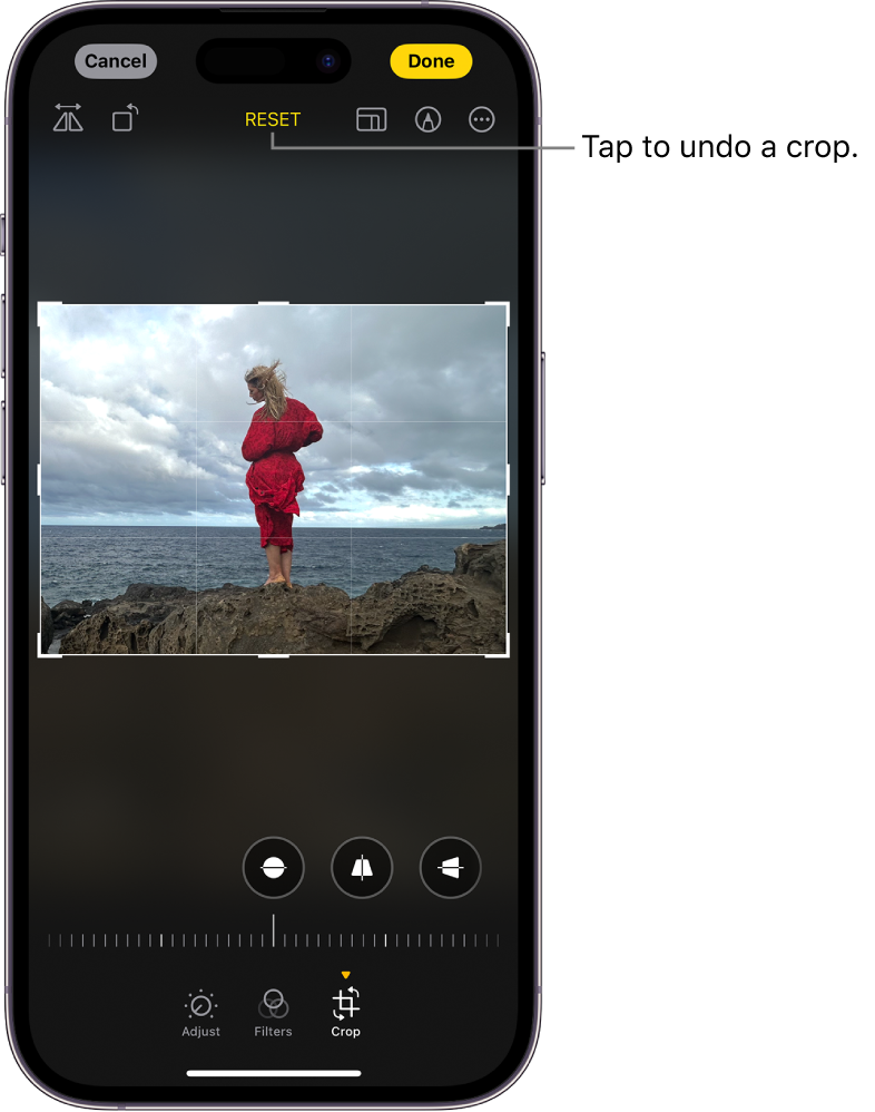 The Edit screen with a photo in the center. At the bottom of the screen, from left to right, are the Adjust, Filters, and Crop buttons. The Crop button is selected and there is a slider to adjust the geometry enhancements. The Cancel button is in the top-left corner of the screen and the Done button is in the top-right corner of the screen. Also at the top of the screen, from left to right, are the Flip, Auto, Aspect Ratio, Markup, and Plug-ins buttons.