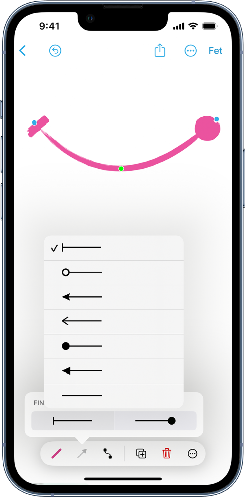 Pissarra de l’app Freeform amb una línia corba i les eines de format visibles. Menú per seleccionar l’estil de l’inici i el final de la línia, situat damunt de les eines de format.