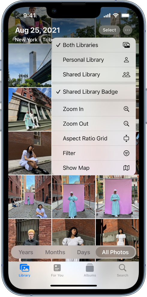 A photo library in the Photos app. The More button at the top right is selected, and the Both Libraries and Shared Library Badge items are selected in the menu.