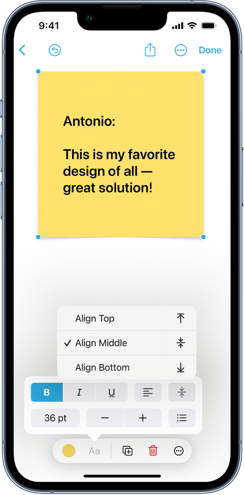 A selected sticky note with the formatting tools visible, including vertical alignment options.