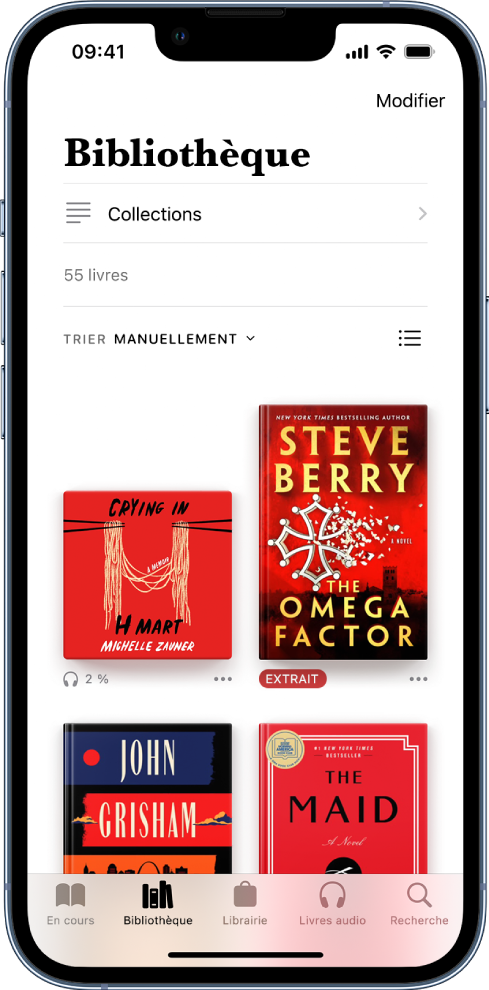 L’écran Bibliothèque dans l’app Livres. En haut de l’écran se trouvent le bouton Collections et les options de tri. L’option de tri Manuellement est sélectionnée. Au milieu de l’écran se trouvent les couvertures des livres de la bibliothèque. En bas de l’écran se trouvent, de gauche à droite, les onglets En cours, Bibliothèque, Librairie, Livres audio , et Rechercher.