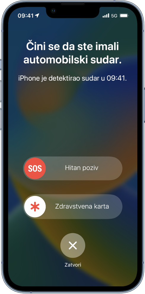 Na zaslonu iPhonea prikazuje se da je detektiran sudar, ispod se nalaze tipke Hitan poziv, Zdravstvena karta i Zatvori.
