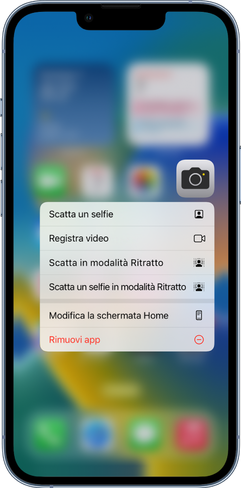 La schermata Home sfocata, con il menu delle azioni rapide della fotocamera visualizzato sotto l'app Fotocamera.