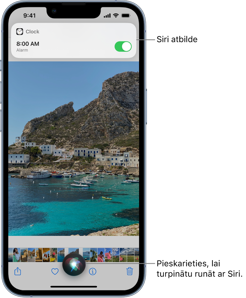 Siri lietotnes Weather ekrānā. Lietotnes Clock paziņojums rāda, ka modinātājs ir ieslēgts uz plkst. 08:00 no rīta. Poga ekrāna apakšā tiek izmantota, lai turpinātu runāt ar Siri.