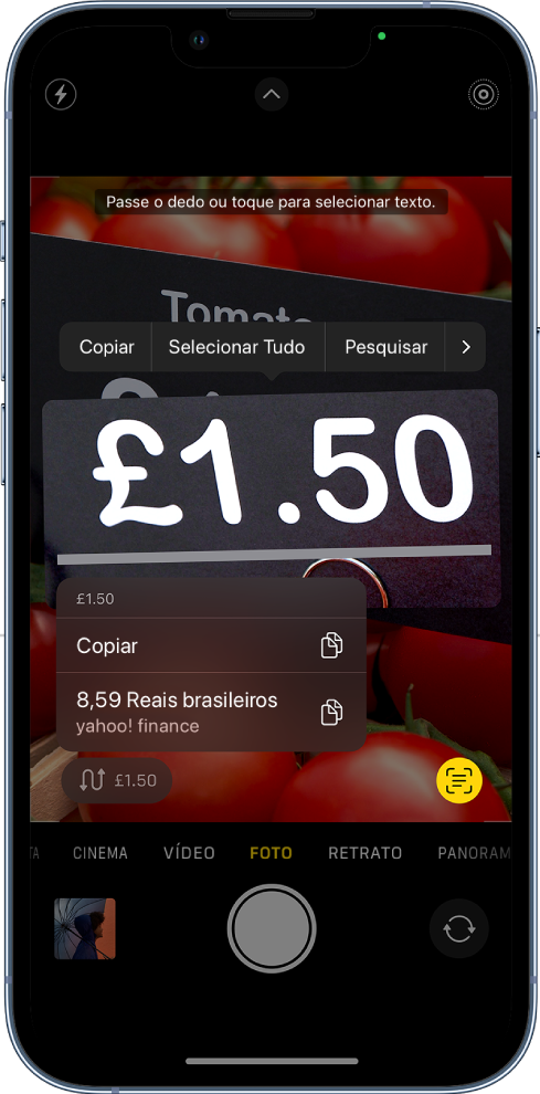 Tela do app Câmera mostrando o botão de ação rápida para converter uma moeda que aparece na moldura da câmera.
