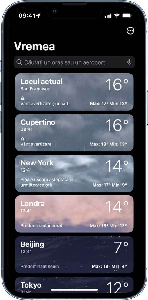 O listă de orașe afișând ora, temperatura curentă, prognoza și temperaturile maxime și minime. În partea de sus a ecranului este câmpul de căutare, iar în colțul din dreapta sus este butonul Mai multe.