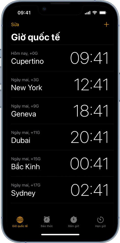Tab Giờ quốc tế, đang hiển thị thời gian tại nhiều thành phố. Nút Sửa ở gần góc phía trên bên trái cho phép bạn sắp xếp lại hoặc xóa đồng hồ. Nút Thêm ở gần góc phía trên bên phải cho phép bạn thêm nhiều đồng hồ hơn. Các nút Giờ quốc tế, Báo thức, Bấm giờ và Hẹn giờ nằm ở dưới cùng.