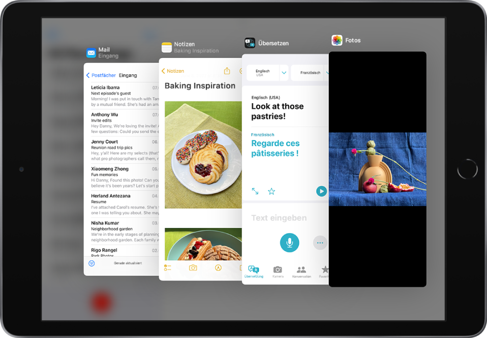 Vier geöffnete Apps in Slide Over-Fenstern: „Mail“, „Notizen“, „Übersetzen“ und „Fotos“.