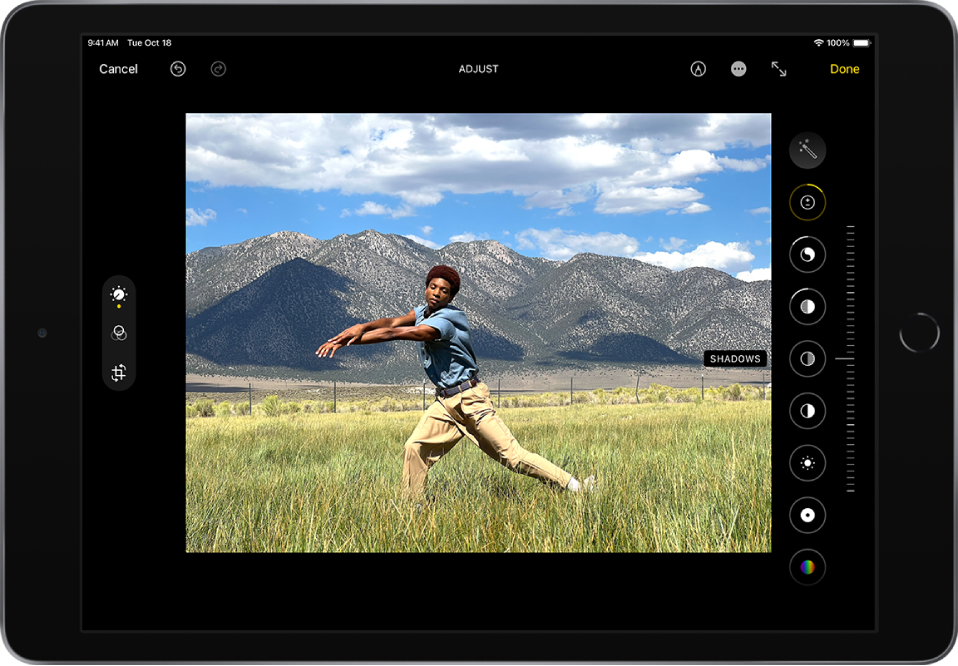 The Edit screen with a photo in the center. To the left of the photo are the buttons for Edit, Filters, and Crop; Edit is selected. To the right of the photo are buttons for editing effects and a slider to adjust each effect level. In the top-left corner is the Cancel button and in the top-right corner are the Markup, Enter Full Screen, and Done buttons.