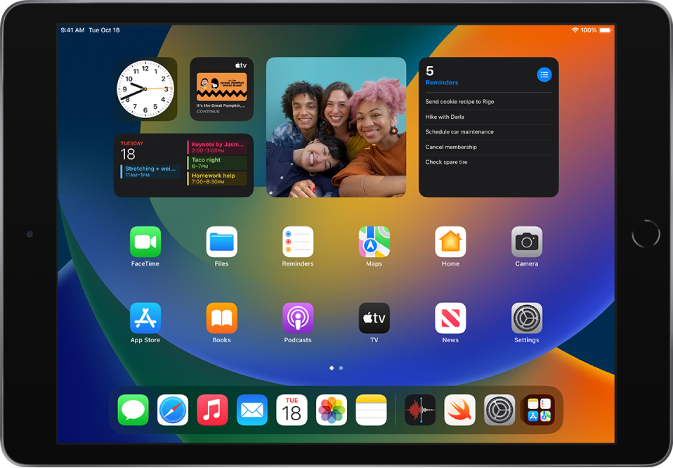 The iPad Home Screen with Dark Mode on.