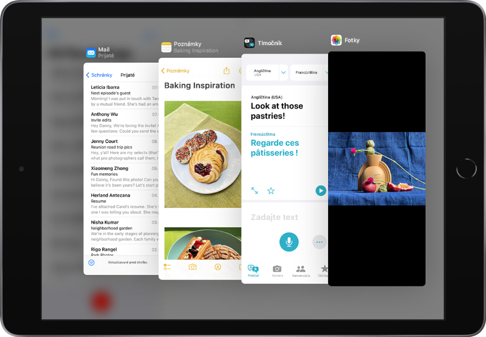 Štyri apky otvorené v oknách Slide Over vrátane apiek Mail, Poznámky, Tlmočník a Fotky.