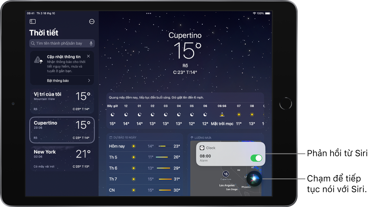 Siri trên màn hình ứng dụng Thời tiết. Một thông báo từ ứng dụng Đồng hồ cho biết rằng báo thức đã được bật cho lúc 8:00 sáng. Một nút ở dưới cùng bên phải của màn hình được sử dụng để tiếp tục nói với Siri.