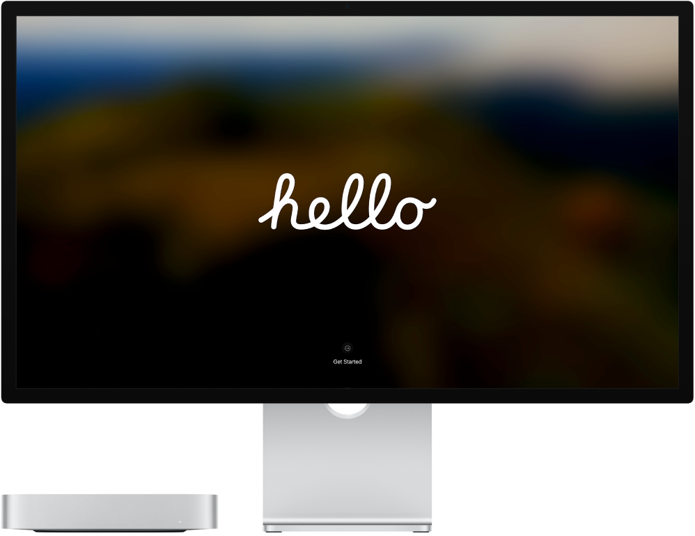 A Mac mini and a Studio Display side by side with the word “hello” on the screen.