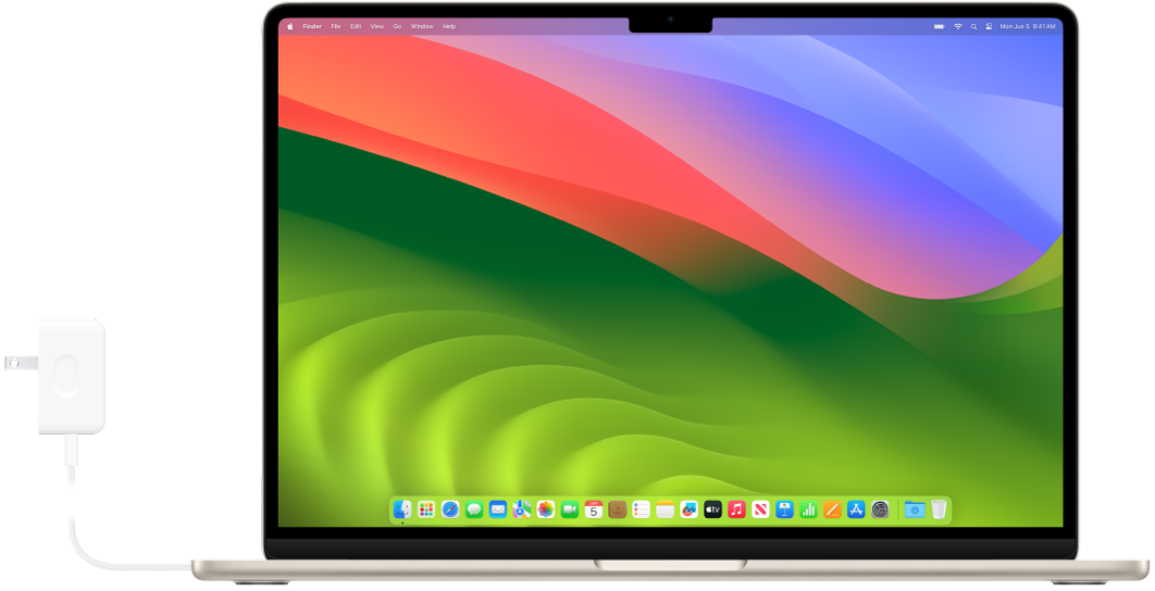 Қуат адаптері тіркелген MacBook Air.