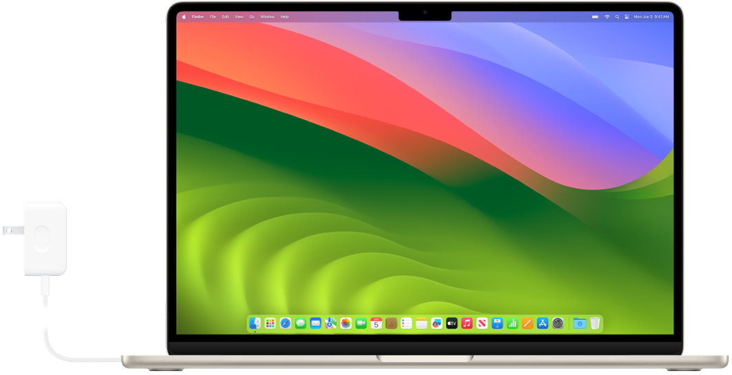전원 어댑터가 연결되어 있는 MacBook Air.