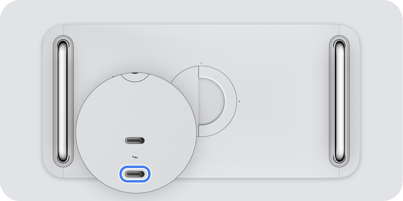 L’arrière d’un Mac Pro de 2019, présentant deux ports Thunderbolt (USB-C), avec celui le plus éloigné du bouton d’alimentation mis en évidence.