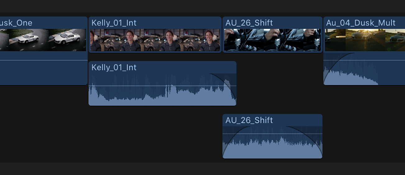 The expanded audio portions of two clips shown overlapping in the timeline