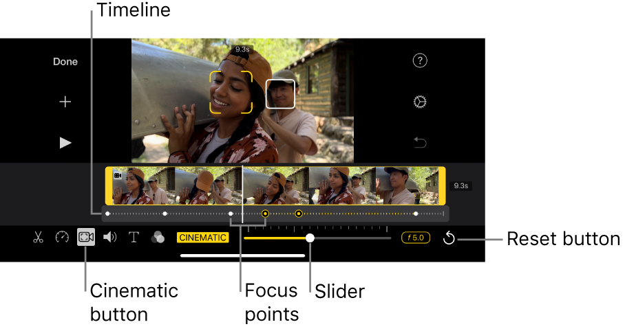 A Cinematic mode video clip in the viewer, with yellow brackets around the object currently in focus and a white box around an object not in focus. The timeline shows white and yellow focus points.