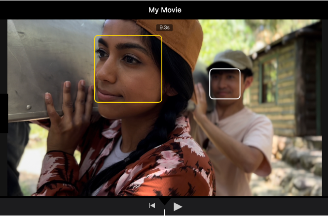 A Cinematic mode clip in the viewer, with a solid yellow box around a face indicating that the focus is locked on that object. A white box appears on an object not in focus.