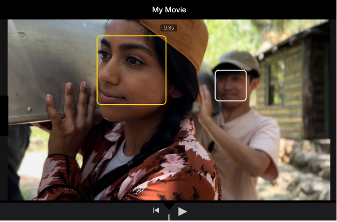 A Cinematic mode clip in the viewer, with a solid yellow box around a face indicating that the focus is locked on that object. A white box appears on an object not in focus.