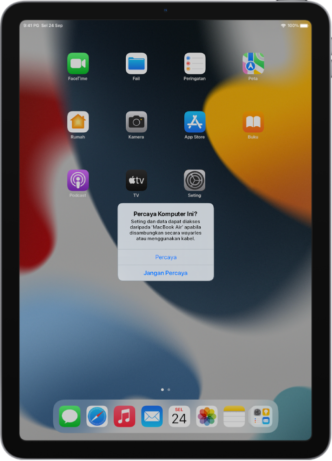 iPad menunjukkan dialog Percaya Komputer Ini? apabila pertama kali disambungkan ke MacBook Pro.