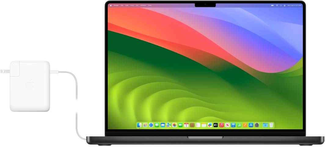 16-дюймовий MacBook Pro з під’єднаним блоком живлення.