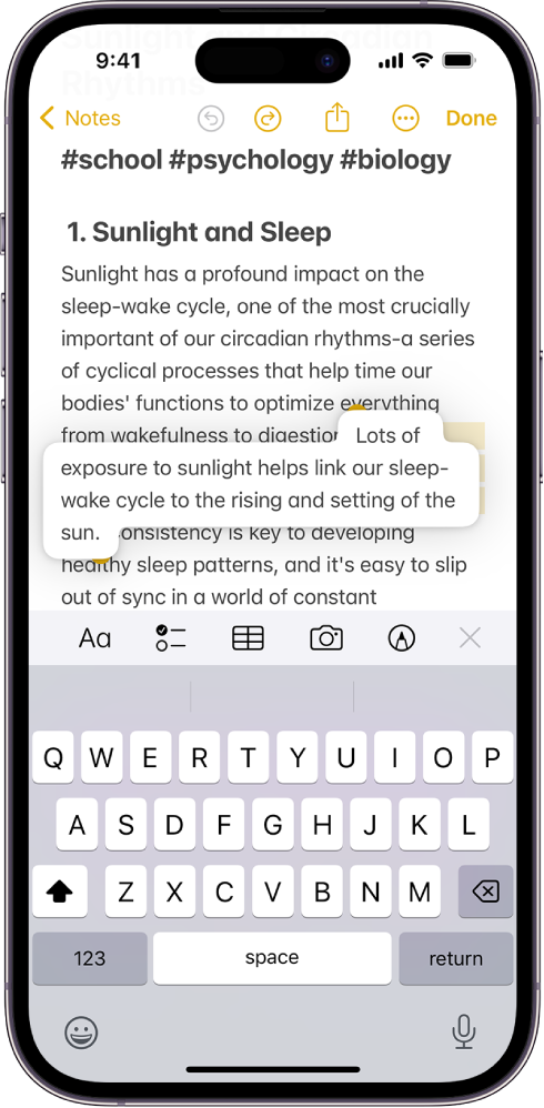 A document is open in the Notes app. The onscreen keyboard is in the bottom half of the screen. Selected text is lifted within the document to be moved to a new location.