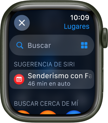 La pantalla de Buscar en la app Mapas con el campo Buscar cerca de la parte superior. Aparece una sugerencia de Siri debajo. Aparece el encabezado Buscar cerca en la parte inferior.