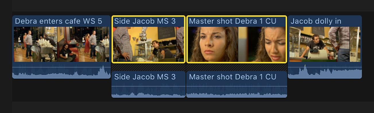 Two adjacent selected clips in the timeline shown with expanded audio