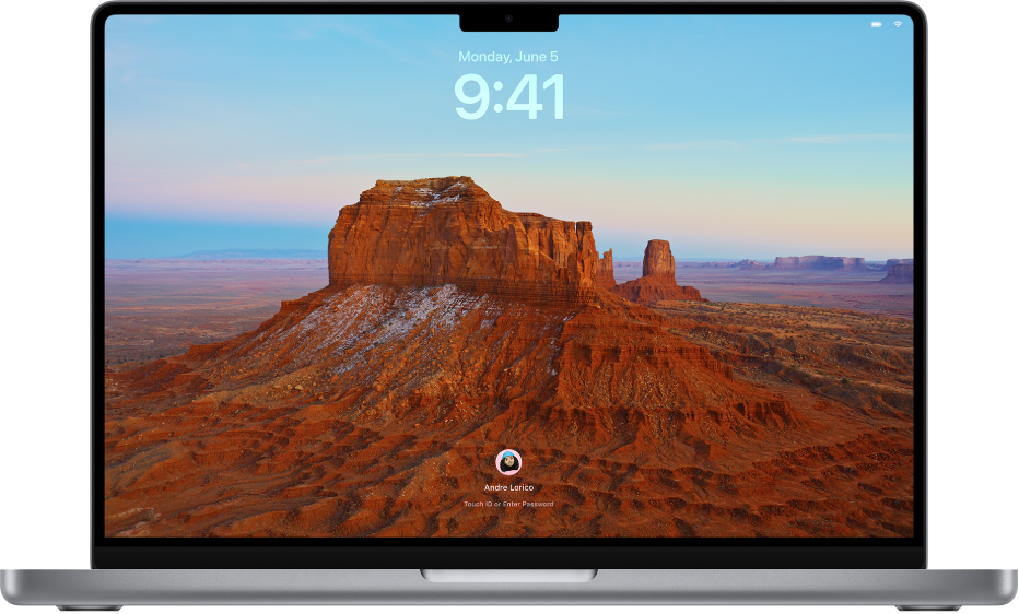 La pantalla bloqueada con una foto de una montaña en el desierto como fondo de escritorio. La foto de perfil del usuario con sesión iniciada actualmente aparece en la parte inferior de la pantalla.
