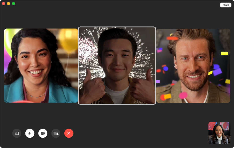 A FaceTime window showing three people with animated backgrounds. The person in the middle is making a thumbs-up gesture with both hands.