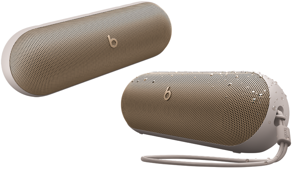 Dois alto‑falantes Beats Pill champanhe