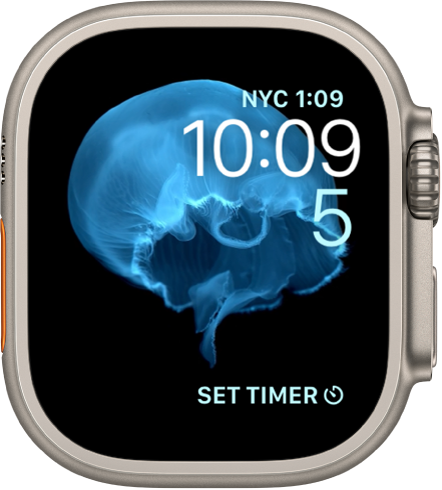 The Motion watch face showing a jellyfish. You can choose which object is in motion and add several complications. A World Clock complication is at the top right, the time and date are below, and a Timer complication is at the bottom.
