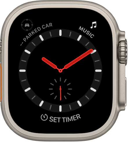 The Explorer watch face is an analog clock. It shows three complications: Parked Car Waypoint at the top left, Music at the top right, and Timer at the bottom.