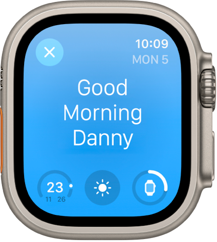 Apple Watchi ekraanil on äratuskuva. Üleval kuvatakse sõnu “Good Morning”. Aku laetuse taset kuvatakse all.